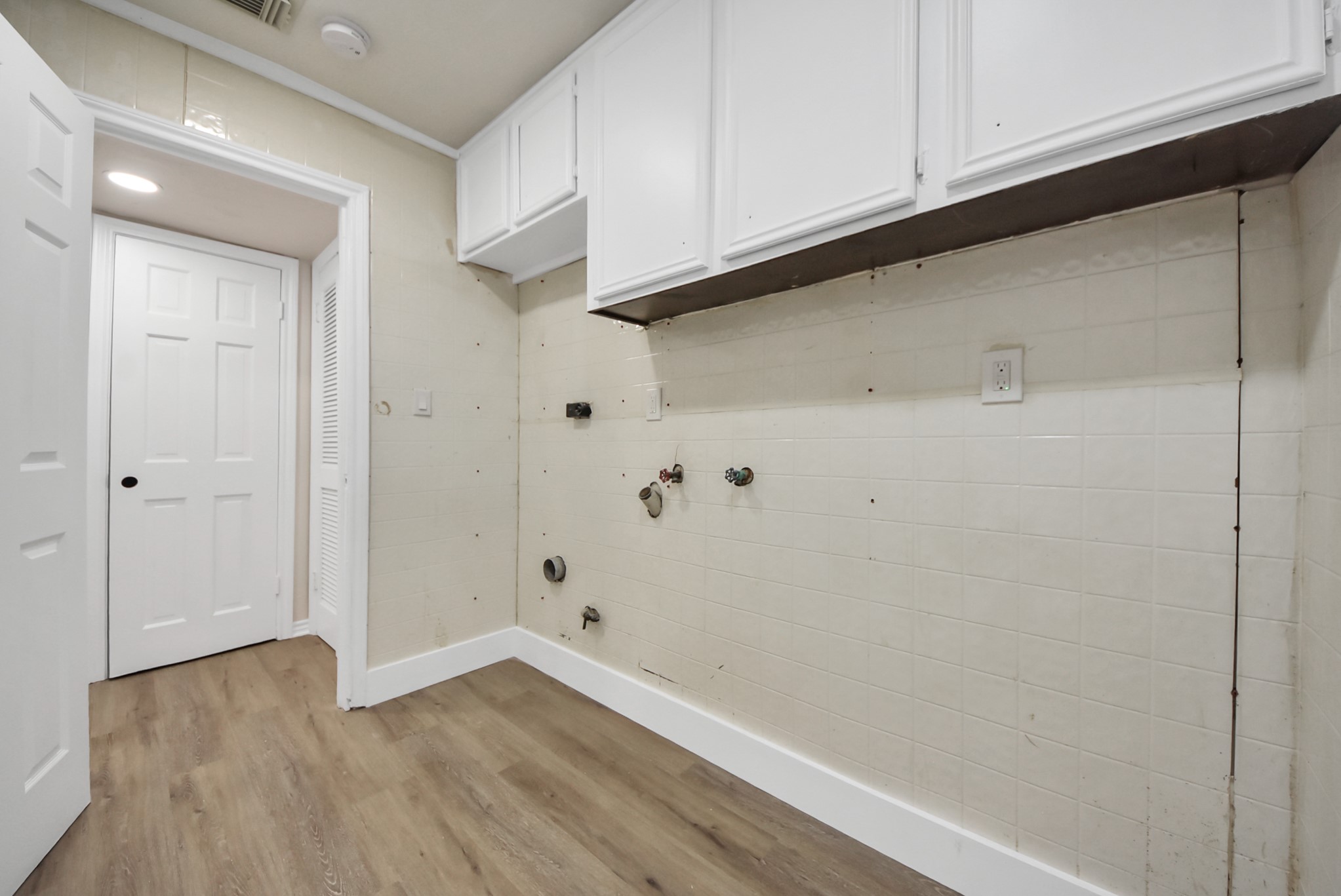 8111 Oak Moss Drive Spring, TX 77379 - Photo 11 of 49 a view of an empty room with wooden floor