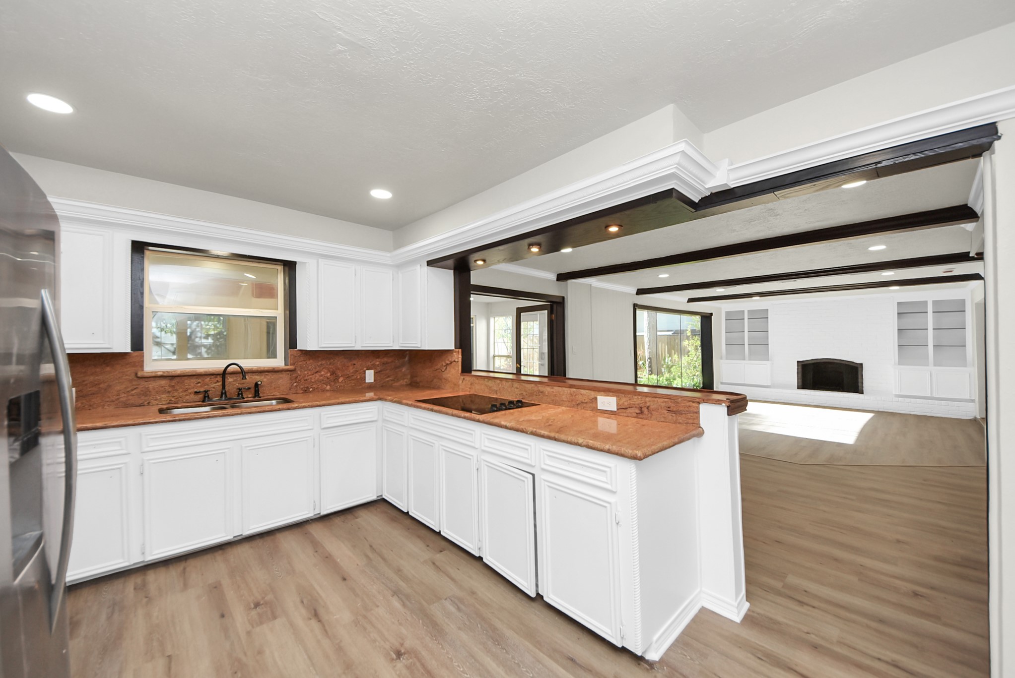 8111 Oak Moss Drive Spring, TX 77379 - Photo 12 of 49 a kitchen with stainless steel appliances granite countertop a sink and cabinets