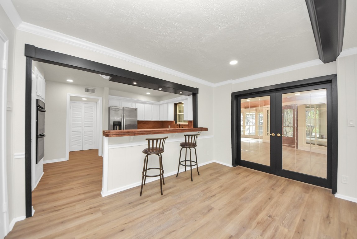 8111 Oak Moss Drive Spring, TX 77379 - Photo 20 of 49 a view of a kitchen with furniture and a window