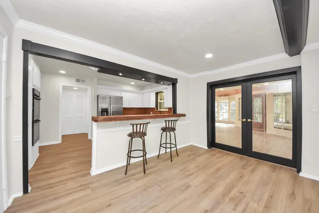 a view of a kitchen with furniture and a window