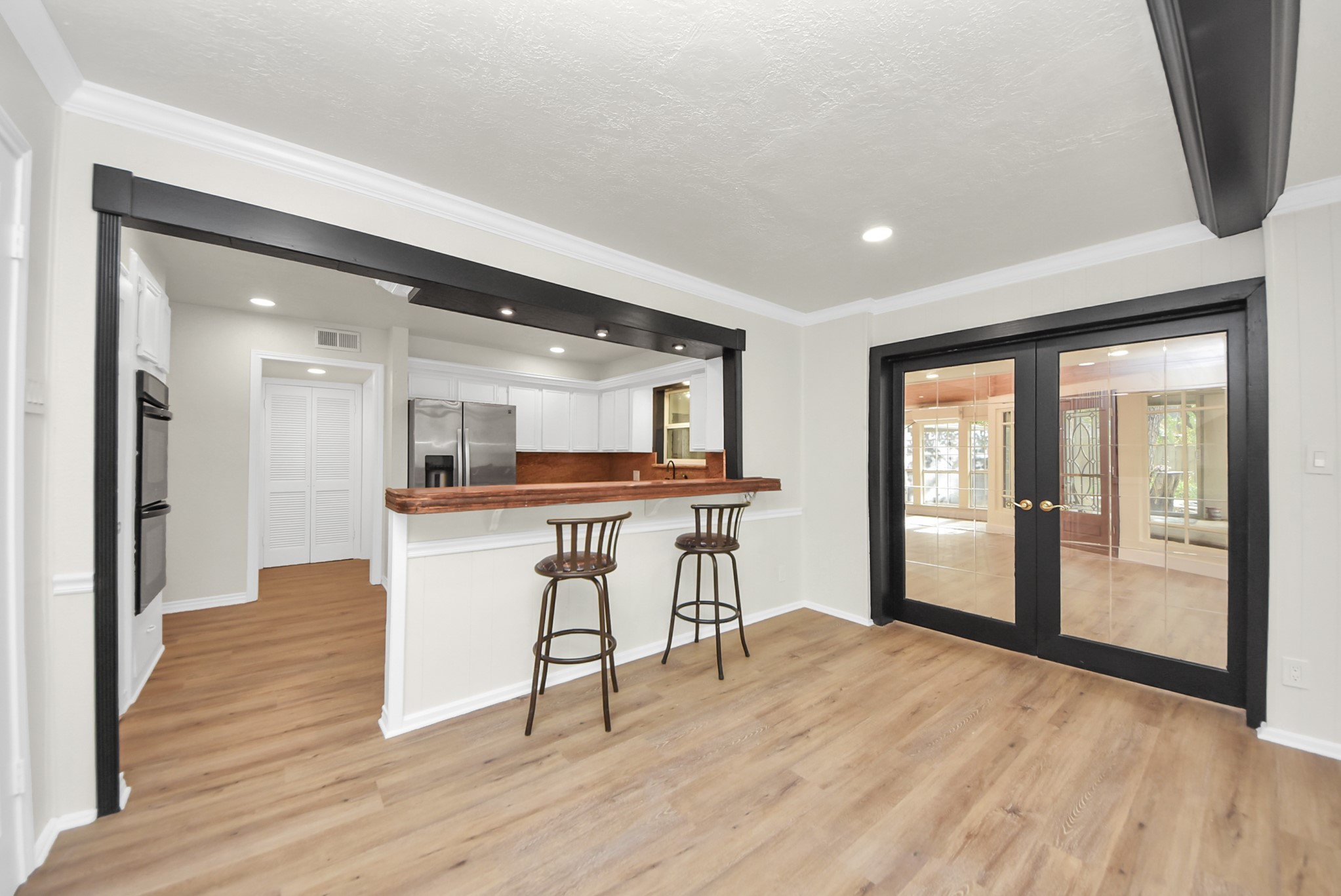 8111 Oak Moss Drive Spring, TX 77379 - Photo 20 of 49 a view of a kitchen with furniture and a window