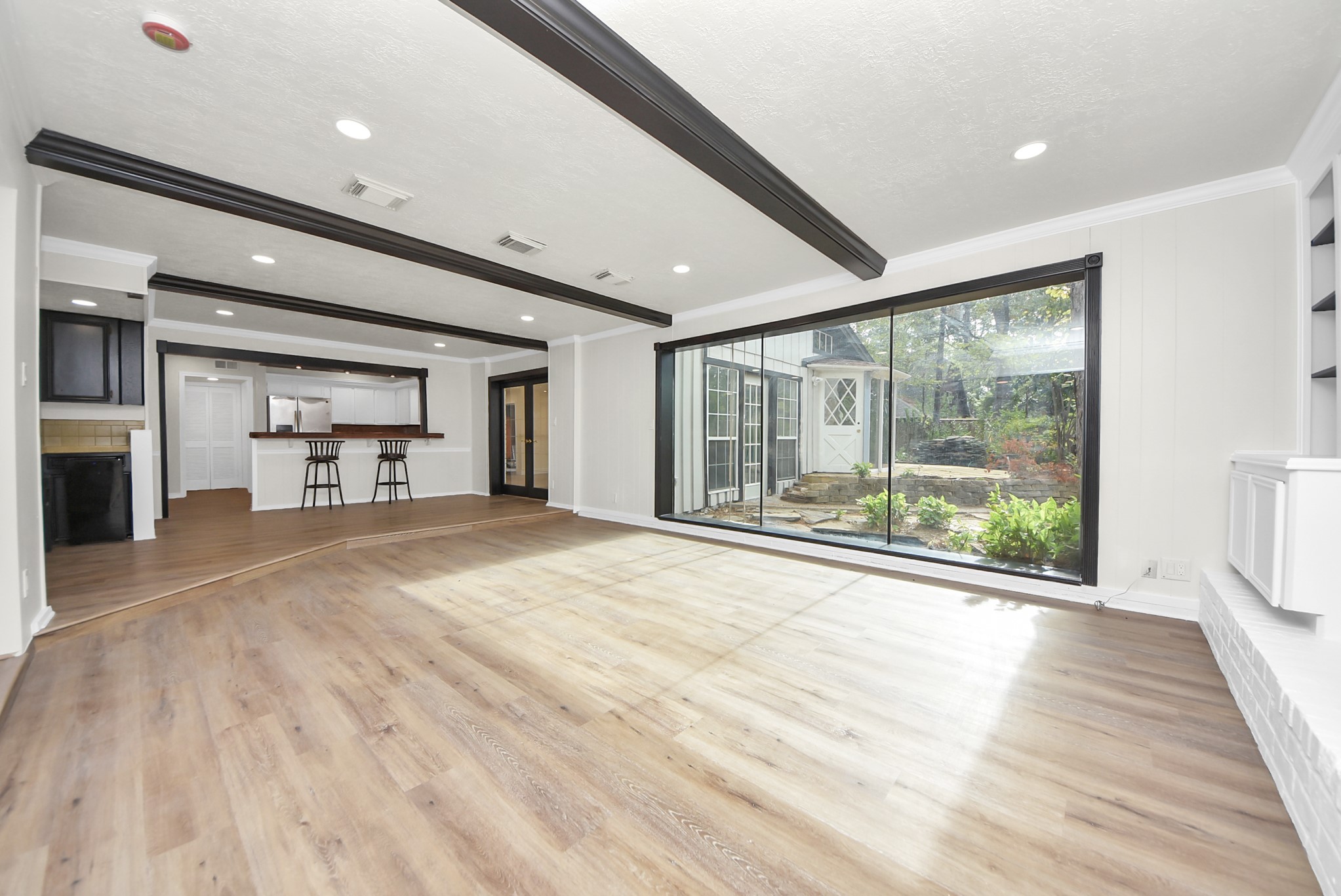 8111 Oak Moss Drive Spring, TX 77379 - Photo 23 of 49 a view of empty room with wooden floor and fan