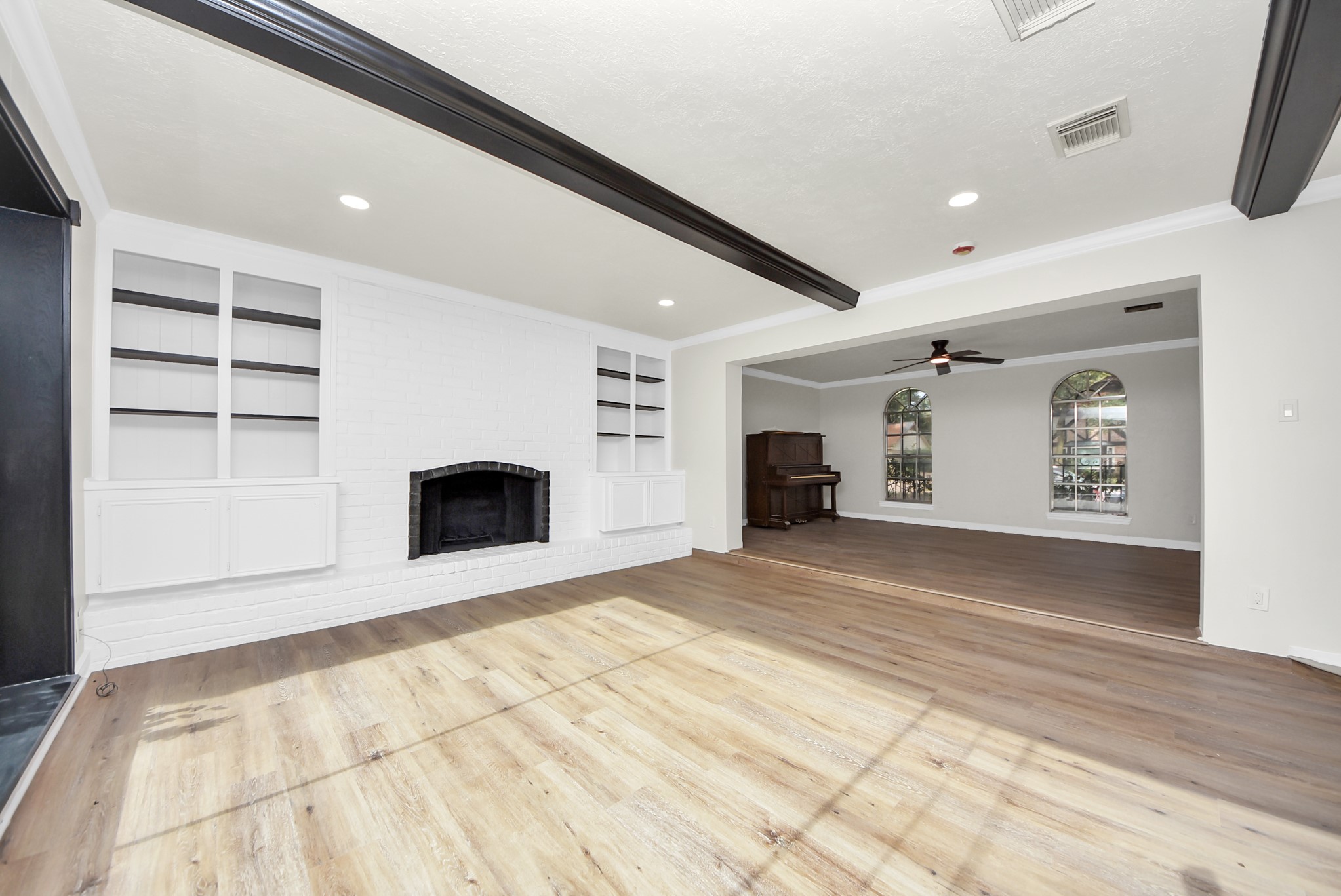 8111 Oak Moss Drive Spring, TX 77379 - Photo 25 of 49 a view of an empty room with a fireplace and a window