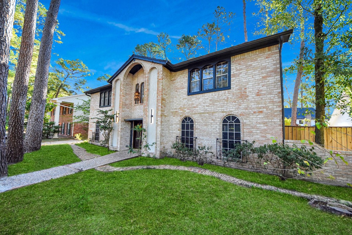 8111 Oak Moss Drive Spring, TX 77379 - Photo 3 of 49 a front view of a house with garden