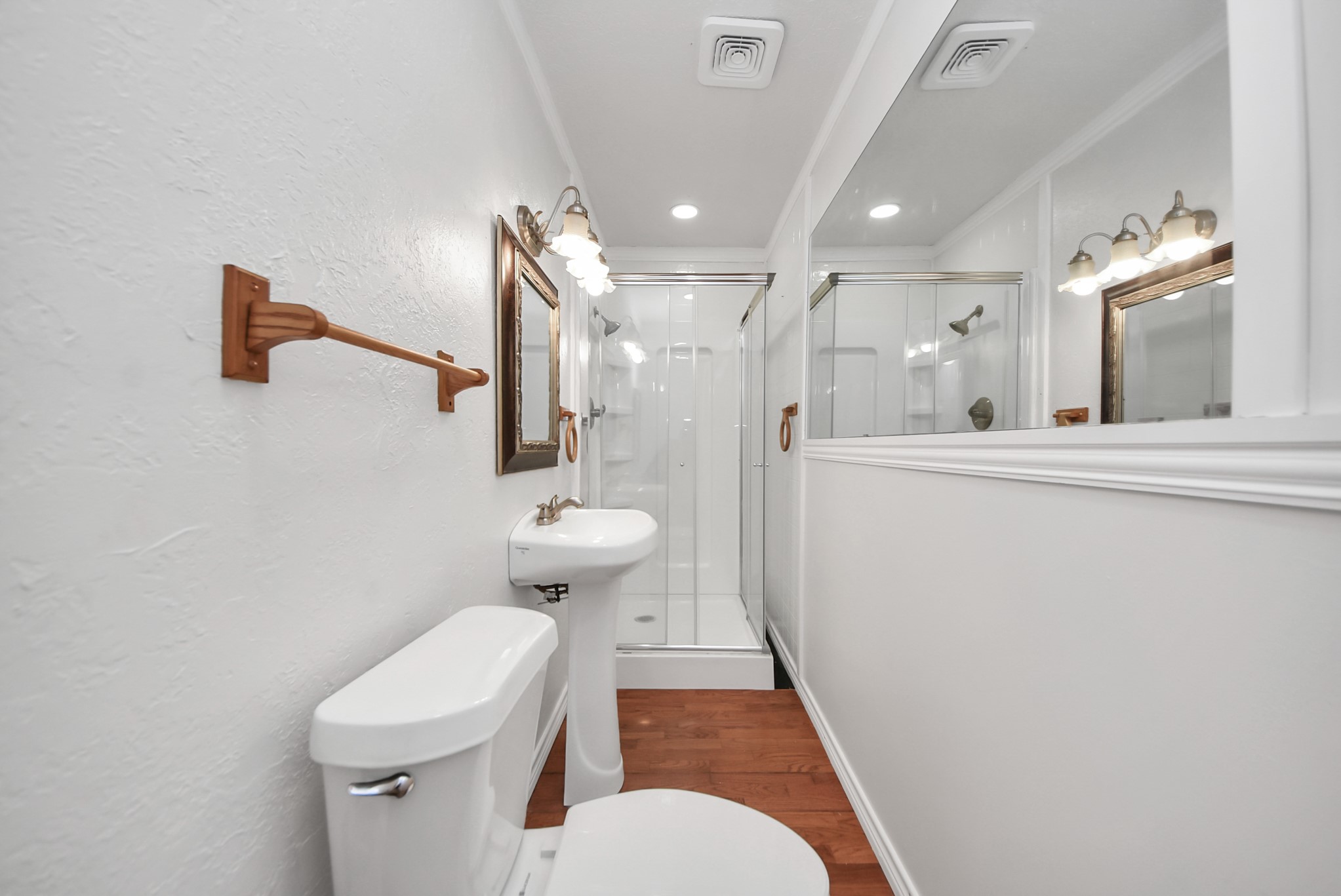 8111 Oak Moss Drive Spring, TX 77379 - Photo 38 of 49 a bathroom with a sink a toilet and a mirror