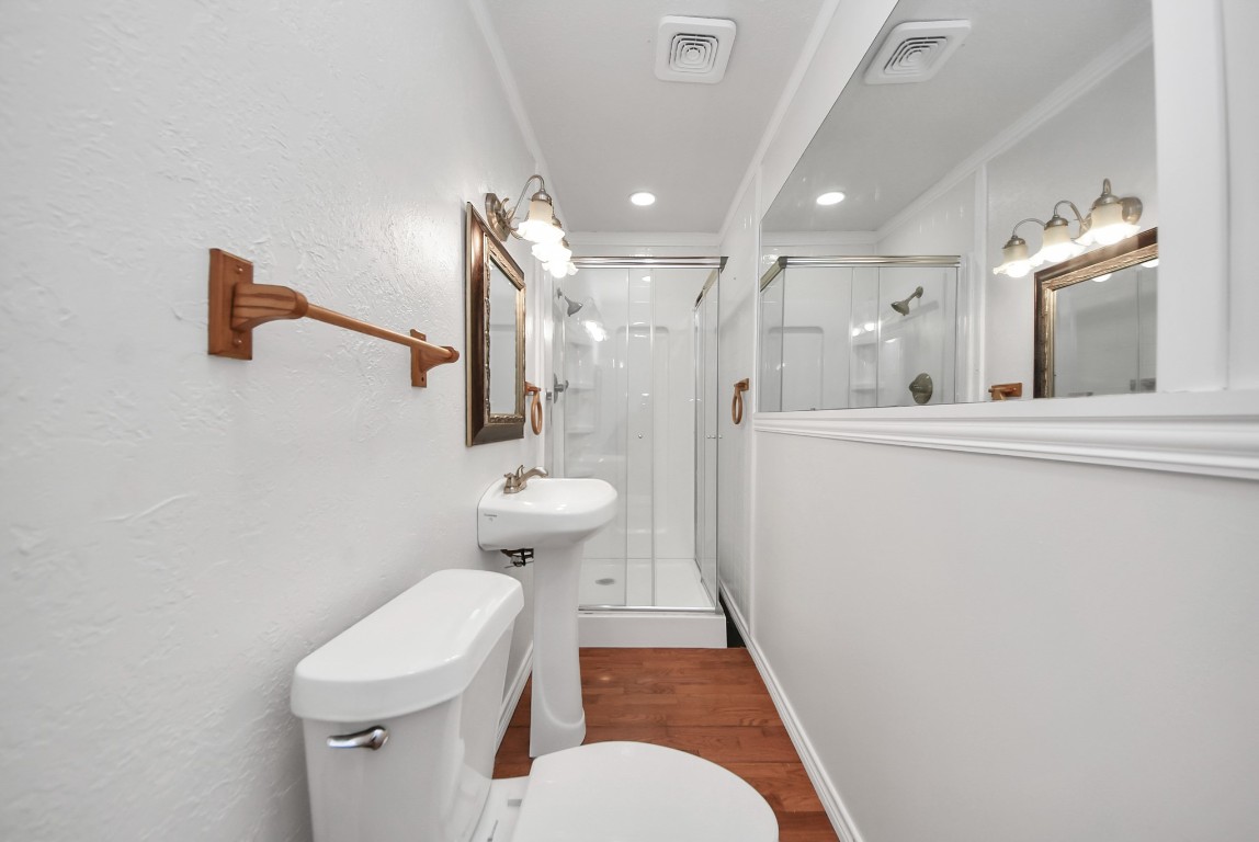 8111 Oak Moss Drive Spring, TX 77379 - Photo 38 of 49 a bathroom with a toilet sink and mirror