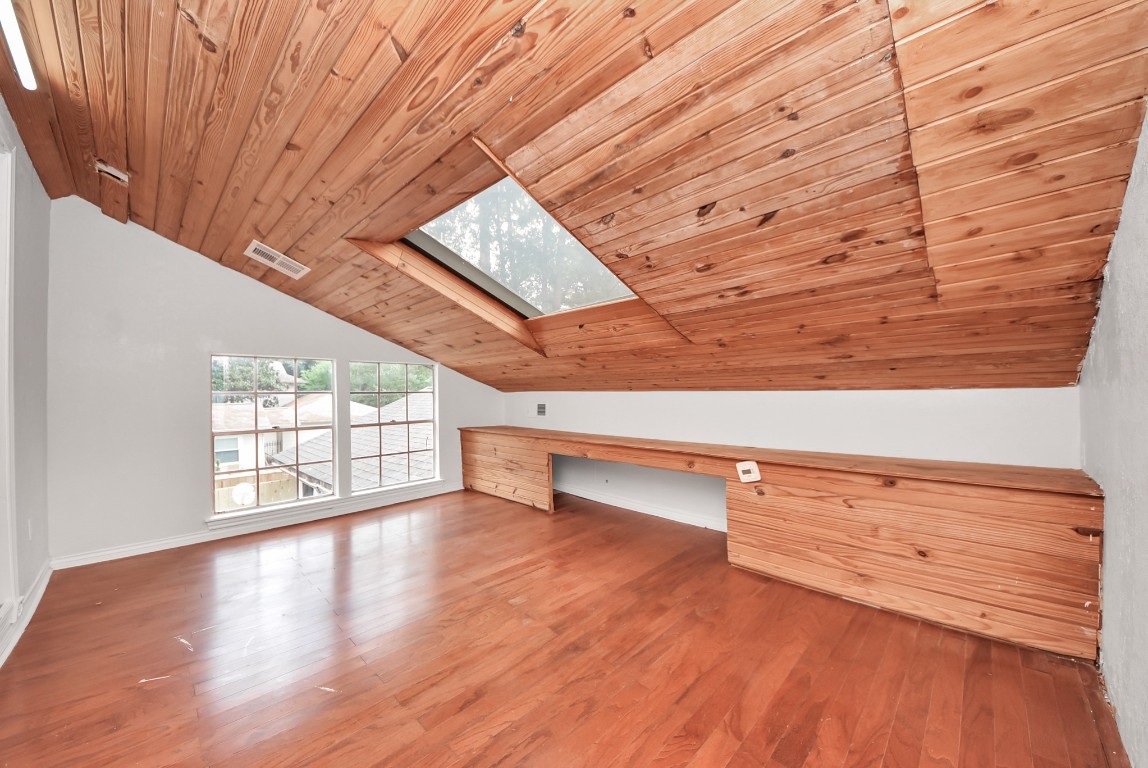 8111 Oak Moss Drive Spring, TX 77379 - Photo 39 of 49 a view of an empty room with wooden floor and a window