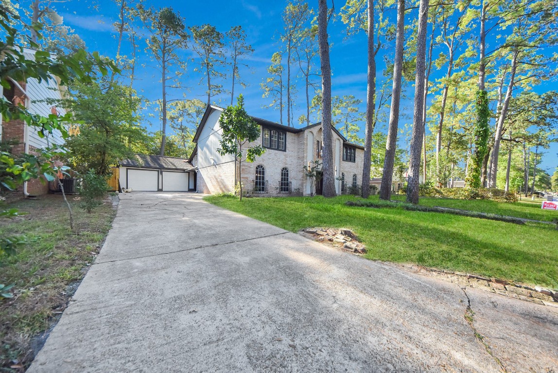 8111 Oak Moss Drive Spring, TX 77379 - Photo 4 of 49 a view of a house with a yard