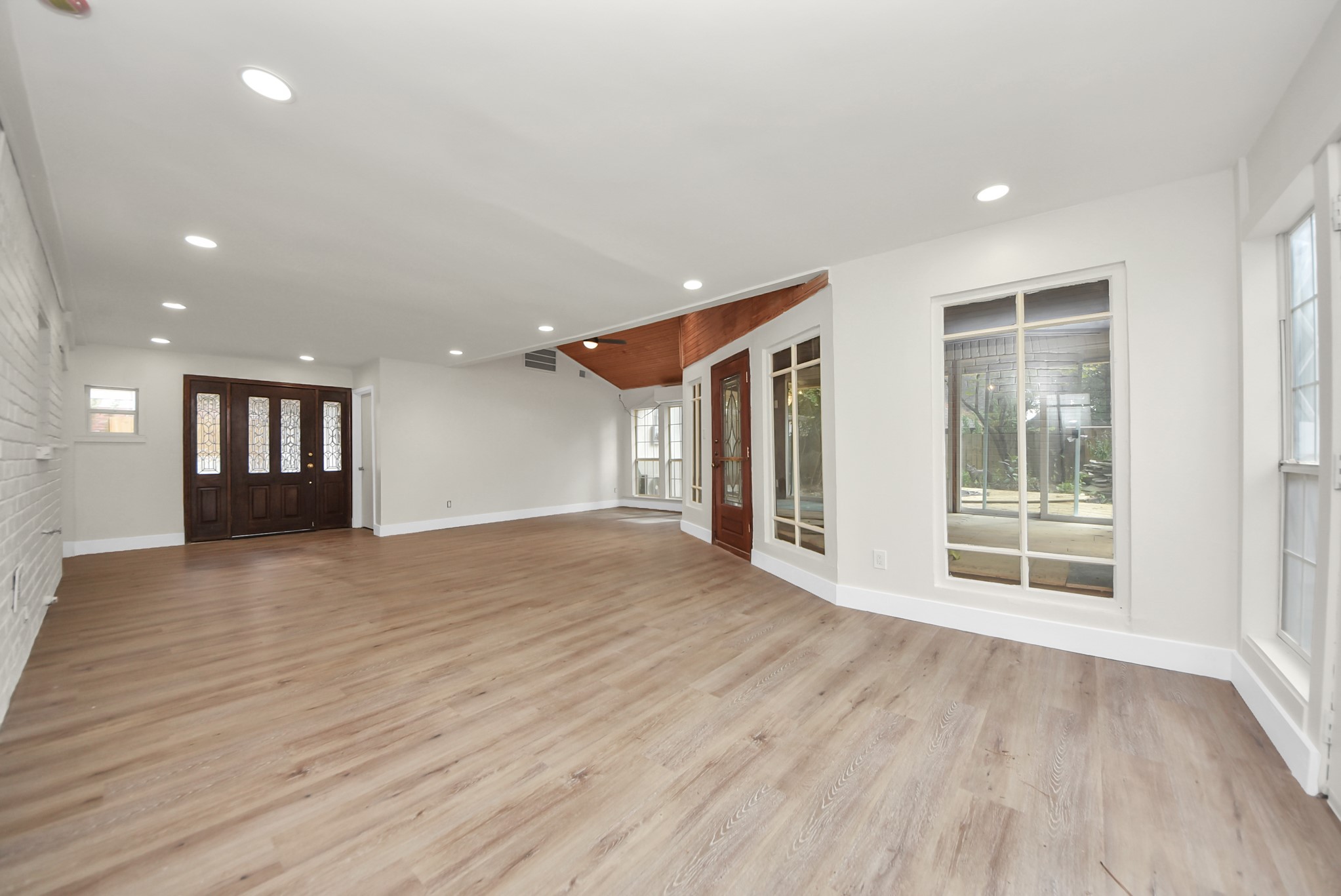 8111 Oak Moss Drive Spring, TX 77379 - Photo 43 of 49 a view of an empty room with wooden floor and a window