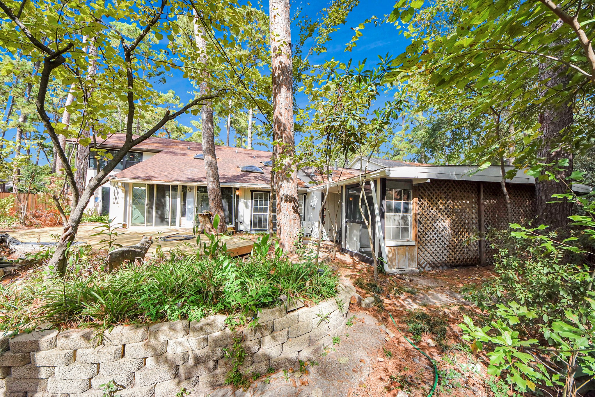 8111 Oak Moss Drive Spring, TX 77379 - Photo 45 of 49 a front view of a house with garden