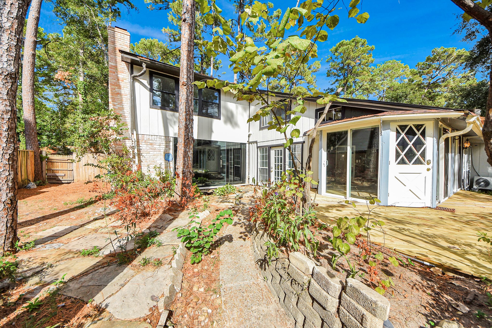 8111 Oak Moss Drive Spring, TX 77379 - Photo 48 of 49 a front view of a house with a yard