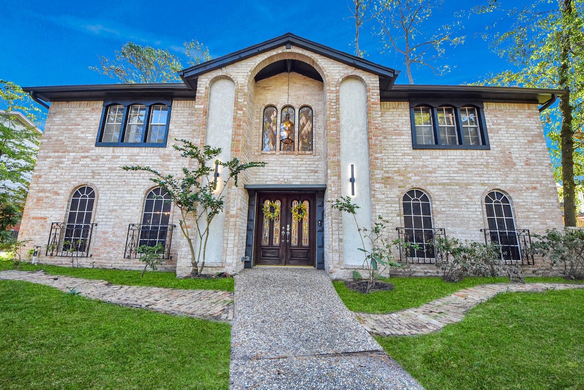 8111 Oak Moss Drive Spring, TX 77379 - Photo 5 of 49 a front view of a house with garden