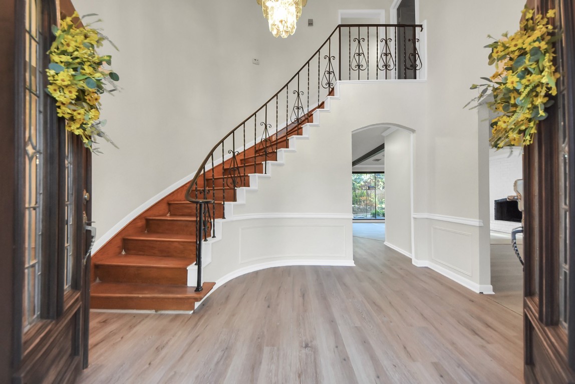 8111 Oak Moss Drive Spring, TX 77379 - Photo 6 of 49 a view of staircase with wooden floor and a potted plant