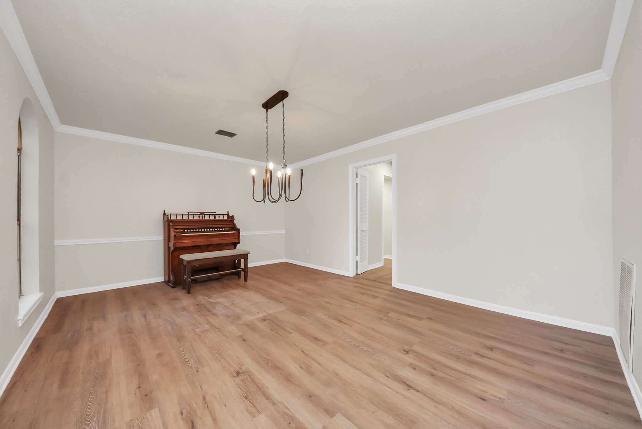 8111 Oak Moss Drive Spring, TX 77379 - Photo 8 of 49 a view of empty room with wooden floor fan and window