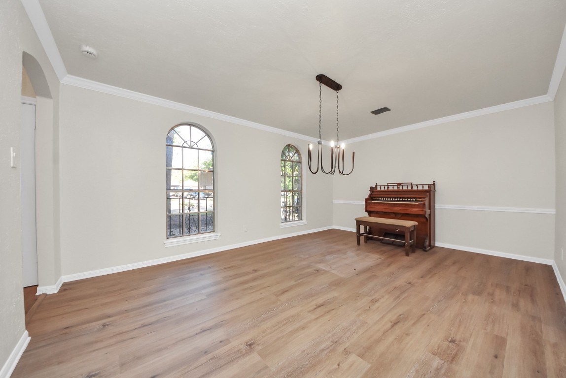 8111 Oak Moss Drive Spring, TX 77379 - Photo 9 of 49 a view of livingroom with furniture wooden floor and window