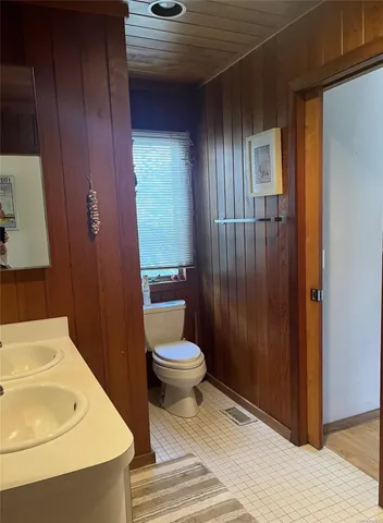 a bathroom with a sink and toilet