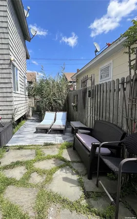 a view of a patio with a table and chairs