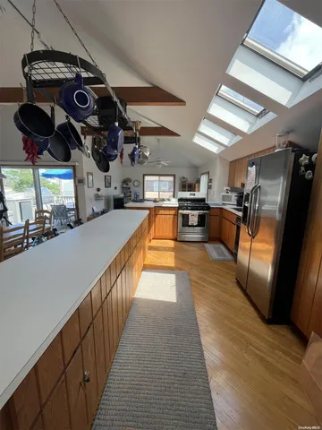 a view of a living room and kitchen