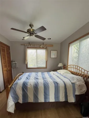 a bedroom with a bed and window