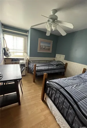 a bedroom with furniture and a window