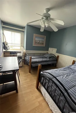 a bedroom with furniture and a window