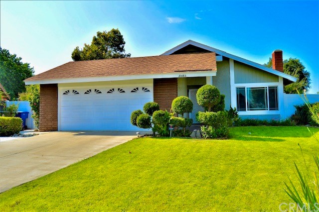 10085 Chula Vista Way Riverside, CA 92503 - Photo 1 of 1 a front view of a house with a yard