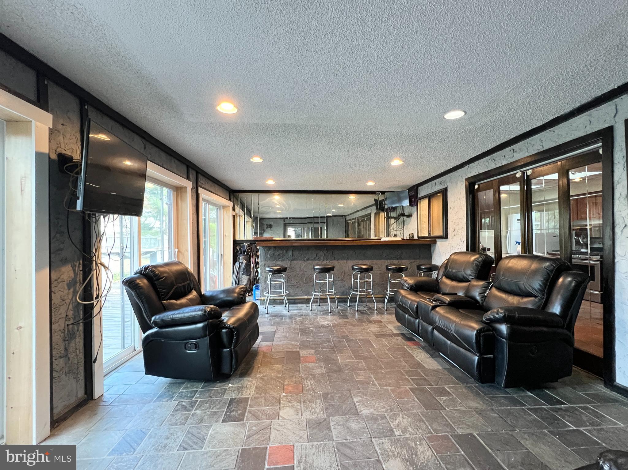 11 Suffolk Court Eastampton, NJ 08060 - Photo 12 of 22 a living room with furniture and a flat screen tv