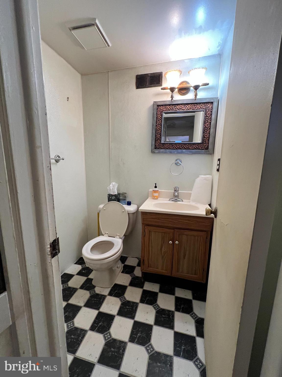 11 Suffolk Court Eastampton, NJ 08060 - Photo 17 of 22 a bathroom with a sink a toilet a mirror and shower curtain