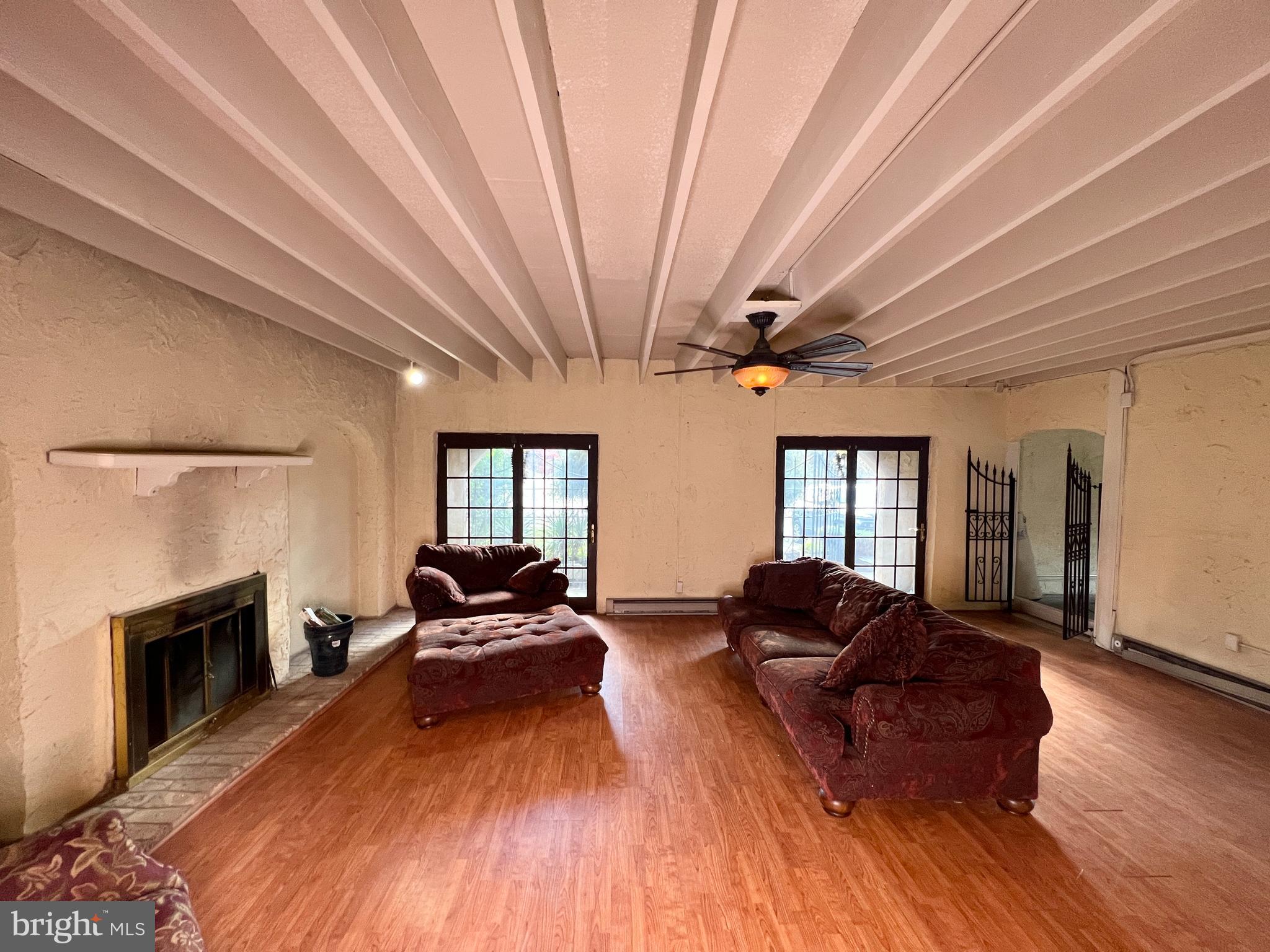11 Suffolk Court Eastampton, NJ 08060 - Photo 8 of 22 a living room with furniture a fireplace and a large window