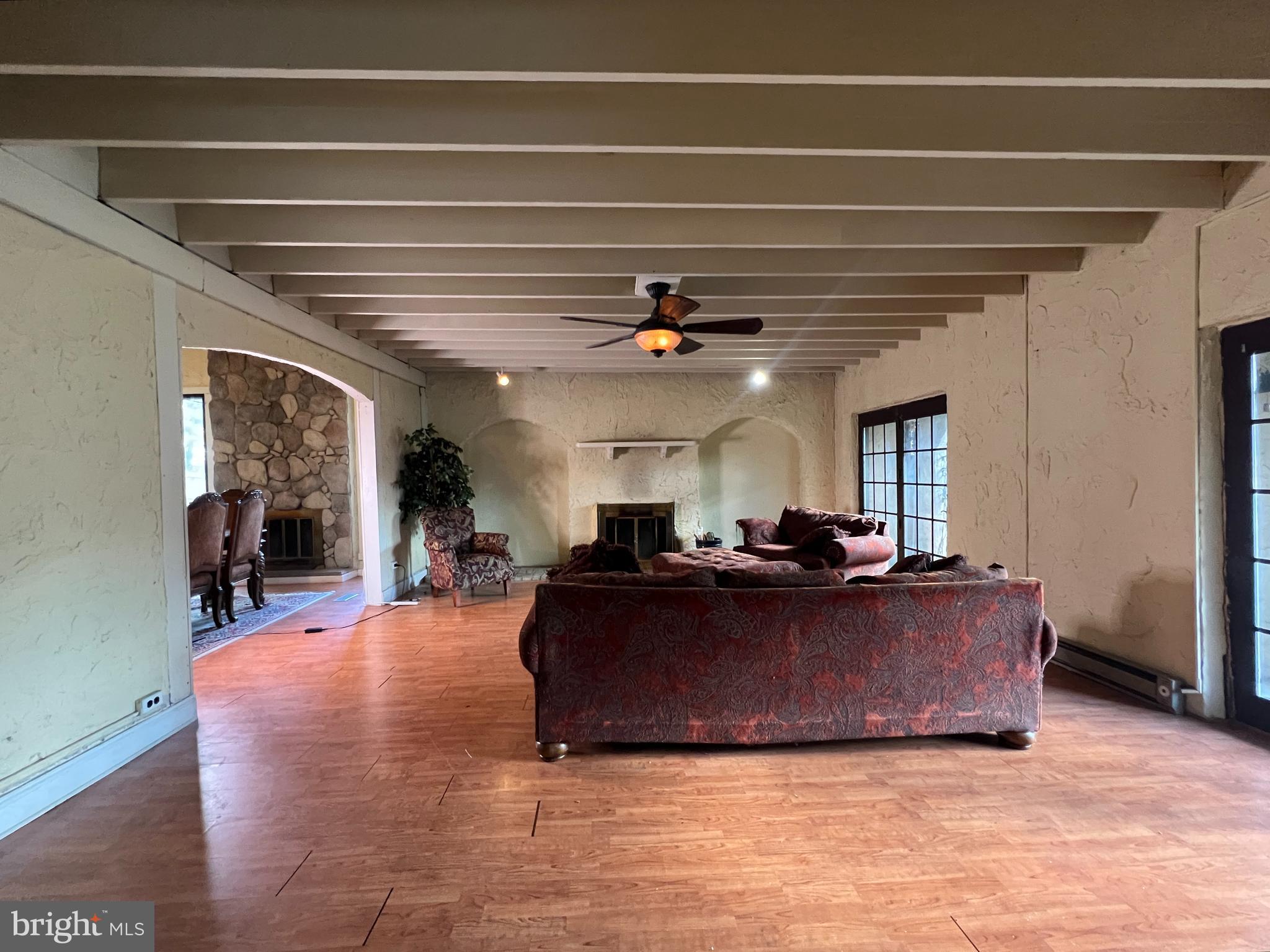 11 Suffolk Court Eastampton, NJ 08060 - Photo 9 of 22 a living room with furniture and a chandelier