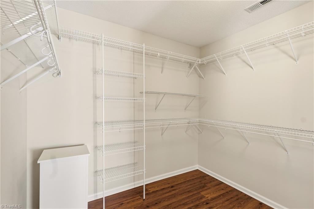 2166 Glen Cove Way High Point, NC 27265 - Photo 12 of 41 Primary bedroom walk-in closet with laundry shoot