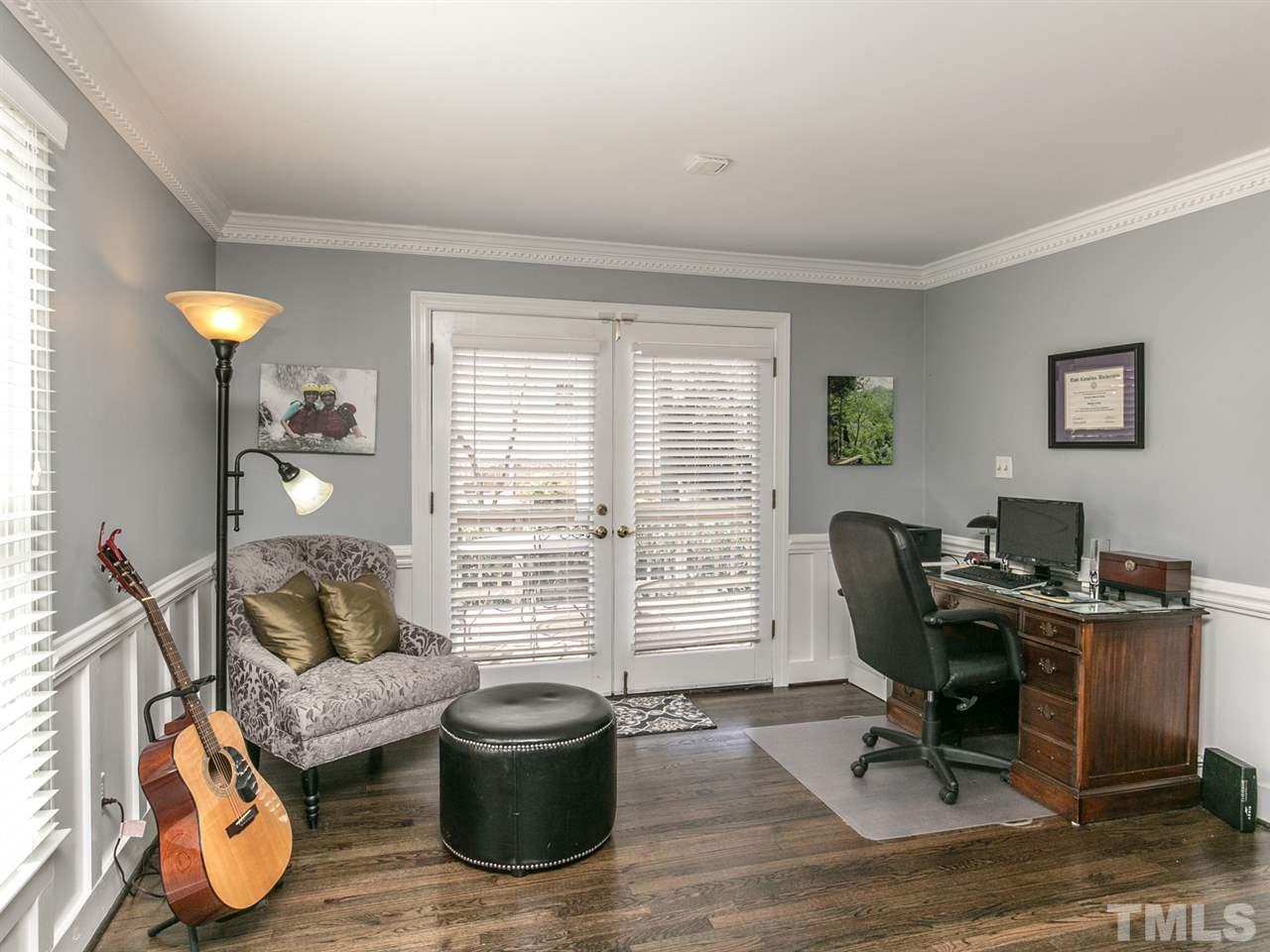 8601 Canoe Court Raleigh, NC 27615 - Photo 3 of 25 Double doors out onto deck fill room with light.