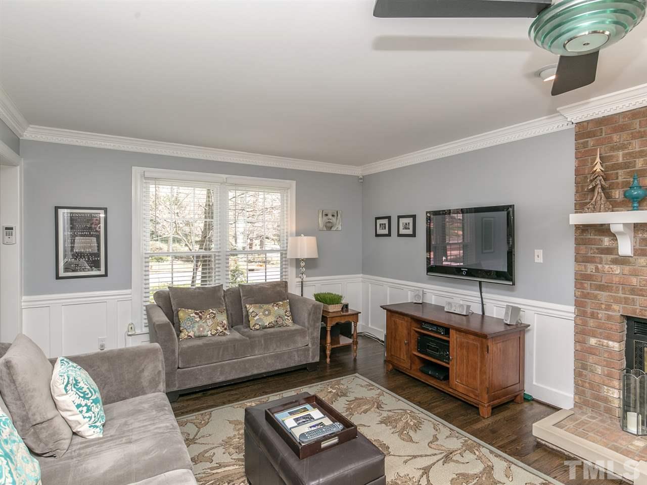8601 Canoe Court Raleigh, NC 27615 - Photo 4 of 25 New Gas logs anchor this beautiful living area.