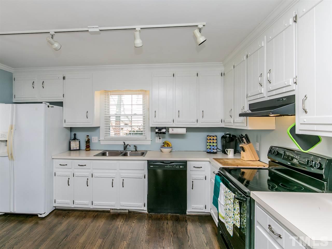 8601 Canoe Court Raleigh, NC 27615 - Photo 8 of 25 Wonderful Kitchen area with refinished hardwoods.
