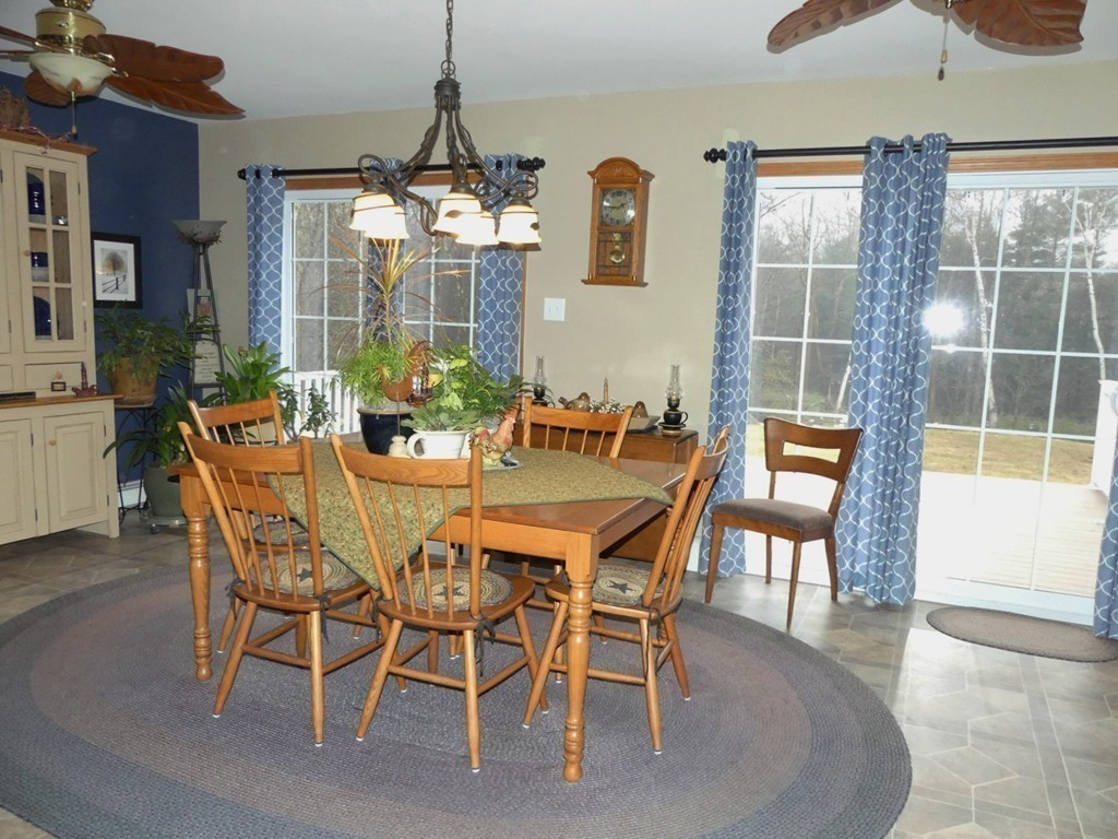 159 Cook Road Templeton, MA 01468 - Photo 10 of 25 a dining room with furniture a chandelier and window