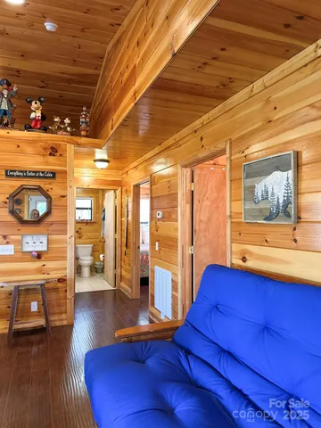 a view of a livingroom with furniture wooden floor and window