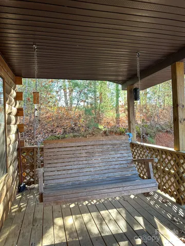 a view of a wooden door with a yard