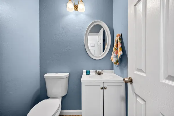 a bathroom with a toilet and a sink
