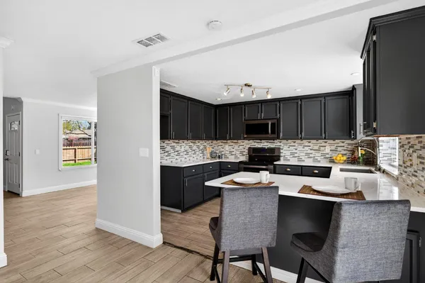a kitchen with a cabinets counter space and appliances