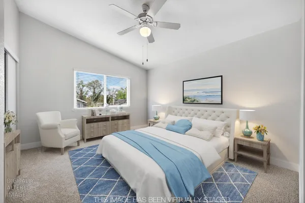 a bedroom with a bed and a couch