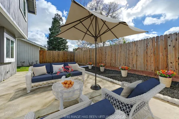 a outdoor space with patio the couches and a umbrella