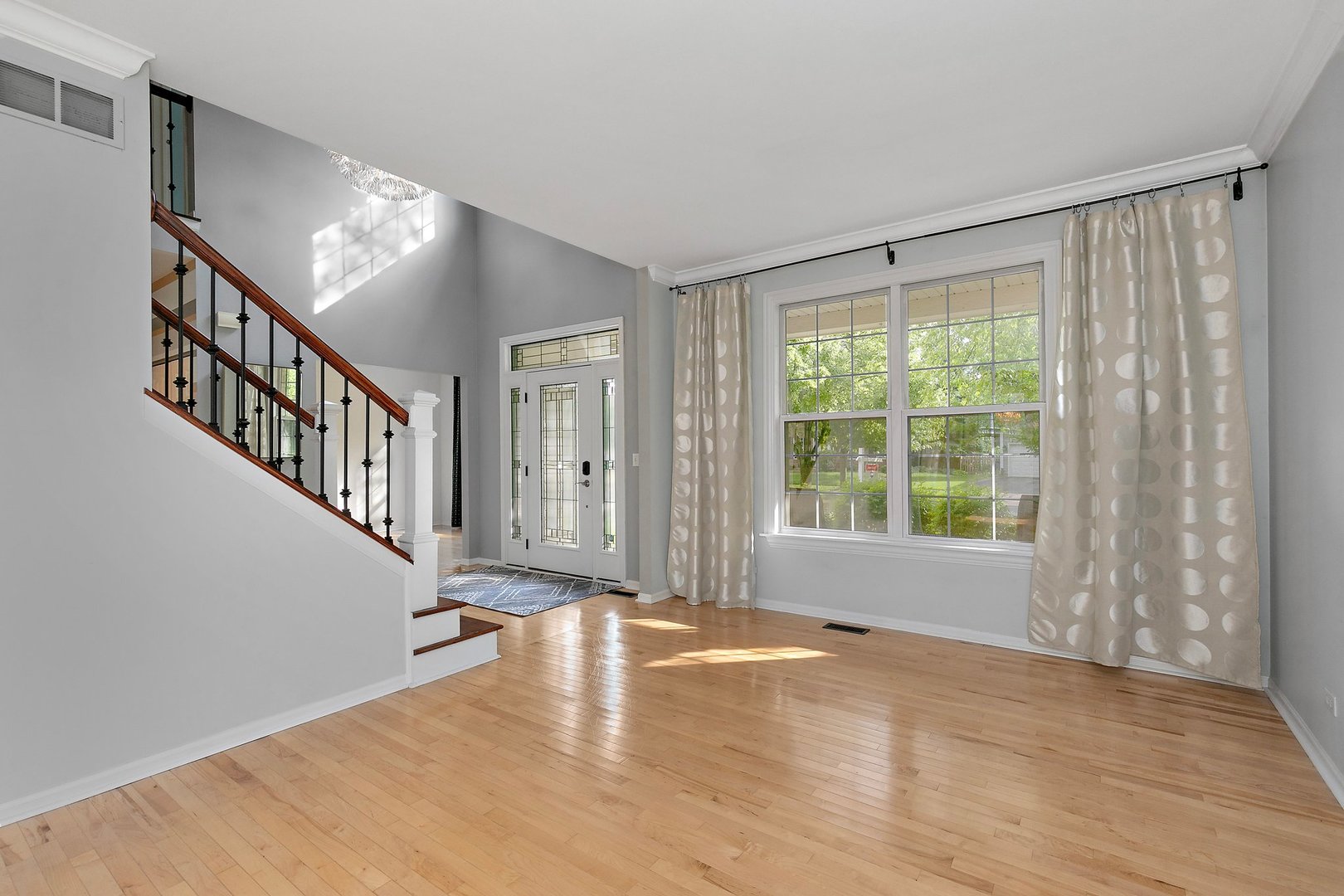 3907 Farmstead Road Carpentersville, IL 60110 - Photo 12 of 49 a view of an empty room with wooden floor and a window