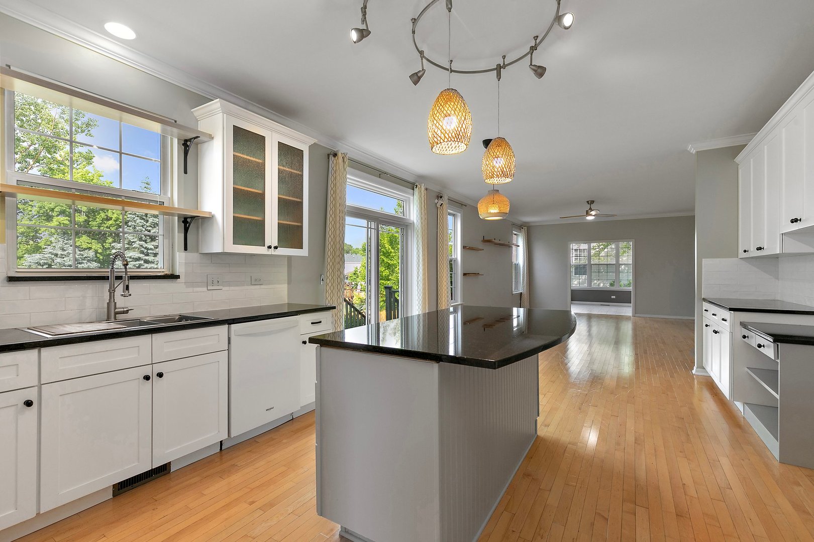3907 Farmstead Road Carpentersville, IL 60110 - Photo 16 of 49 a kitchen with granite countertop a sink cabinets and wooden floor