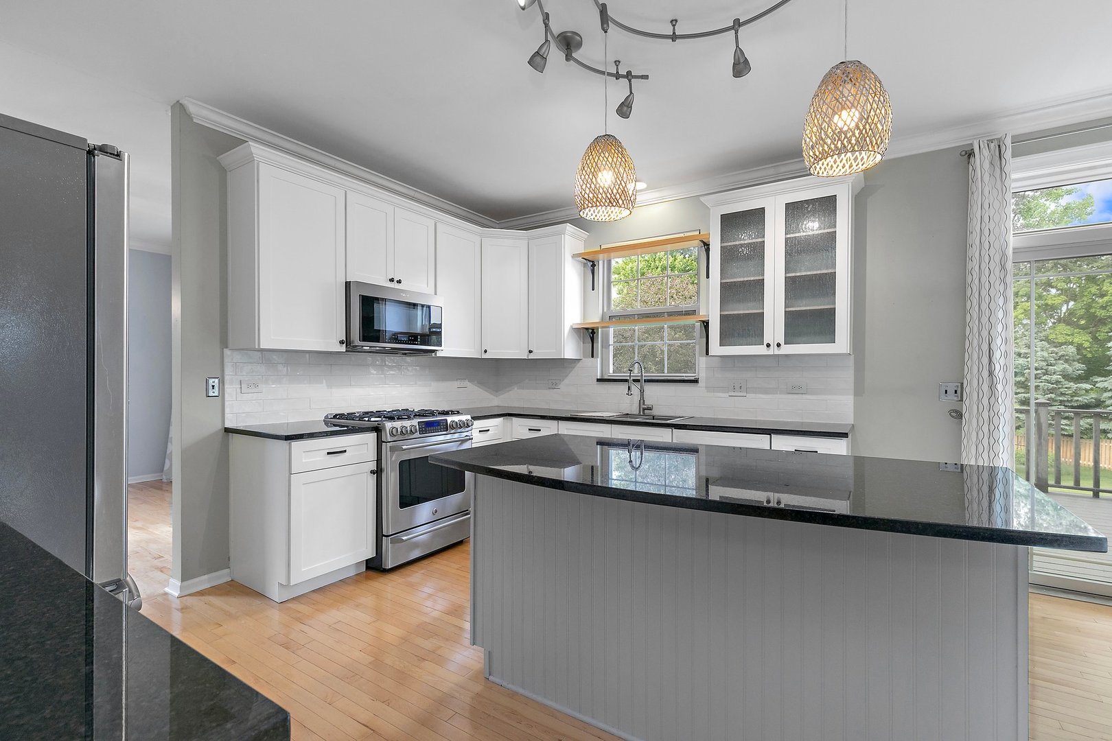 3907 Farmstead Road Carpentersville, IL 60110 - Photo 17 of 49 a kitchen with stainless steel appliances granite countertop a sink a stove and a refrigerator