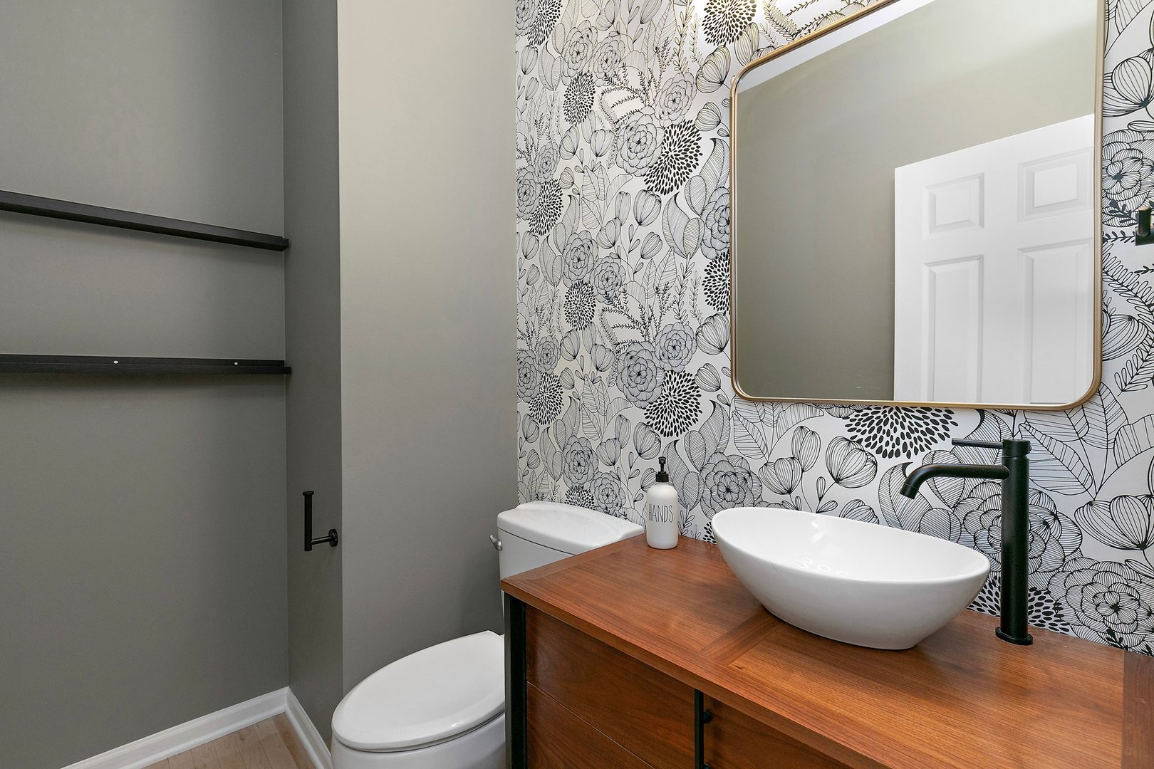 3907 Farmstead Road Carpentersville, IL 60110 - Photo 27 of 49 a bathroom with a toilet a sink and mirror