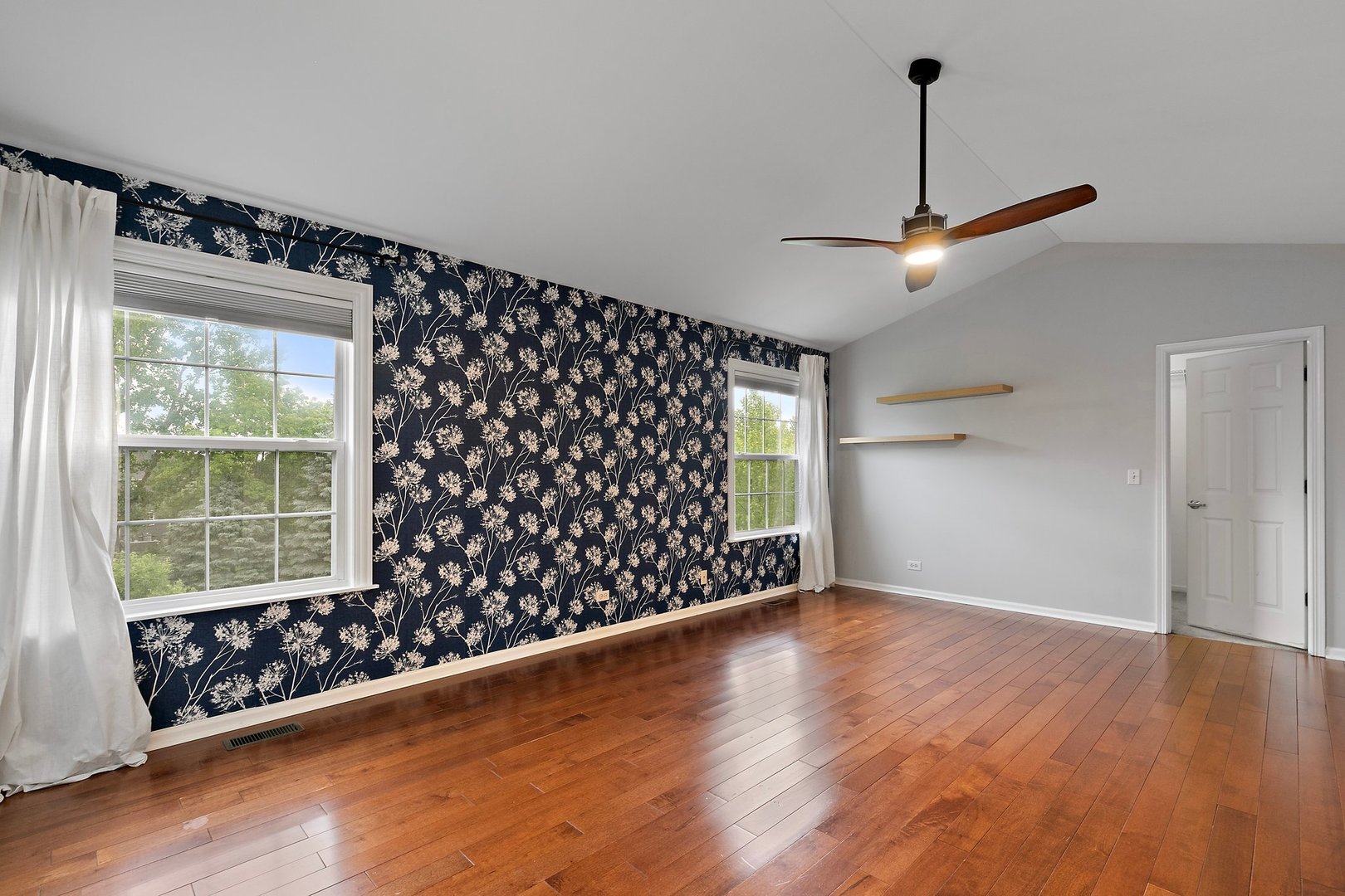 3907 Farmstead Road Carpentersville, IL 60110 - Photo 31 of 49 a view of an empty room with wooden floor and a window