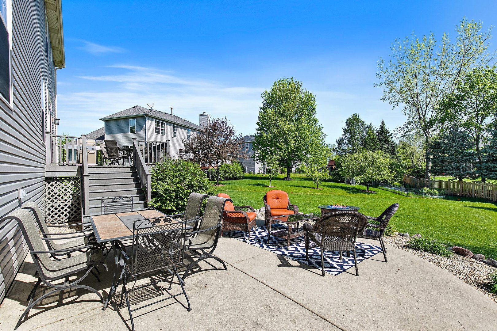 3907 Farmstead Road Carpentersville, IL 60110 - Photo 4 of 49 a view of a patio with table and chairs potted plants with wooden fence