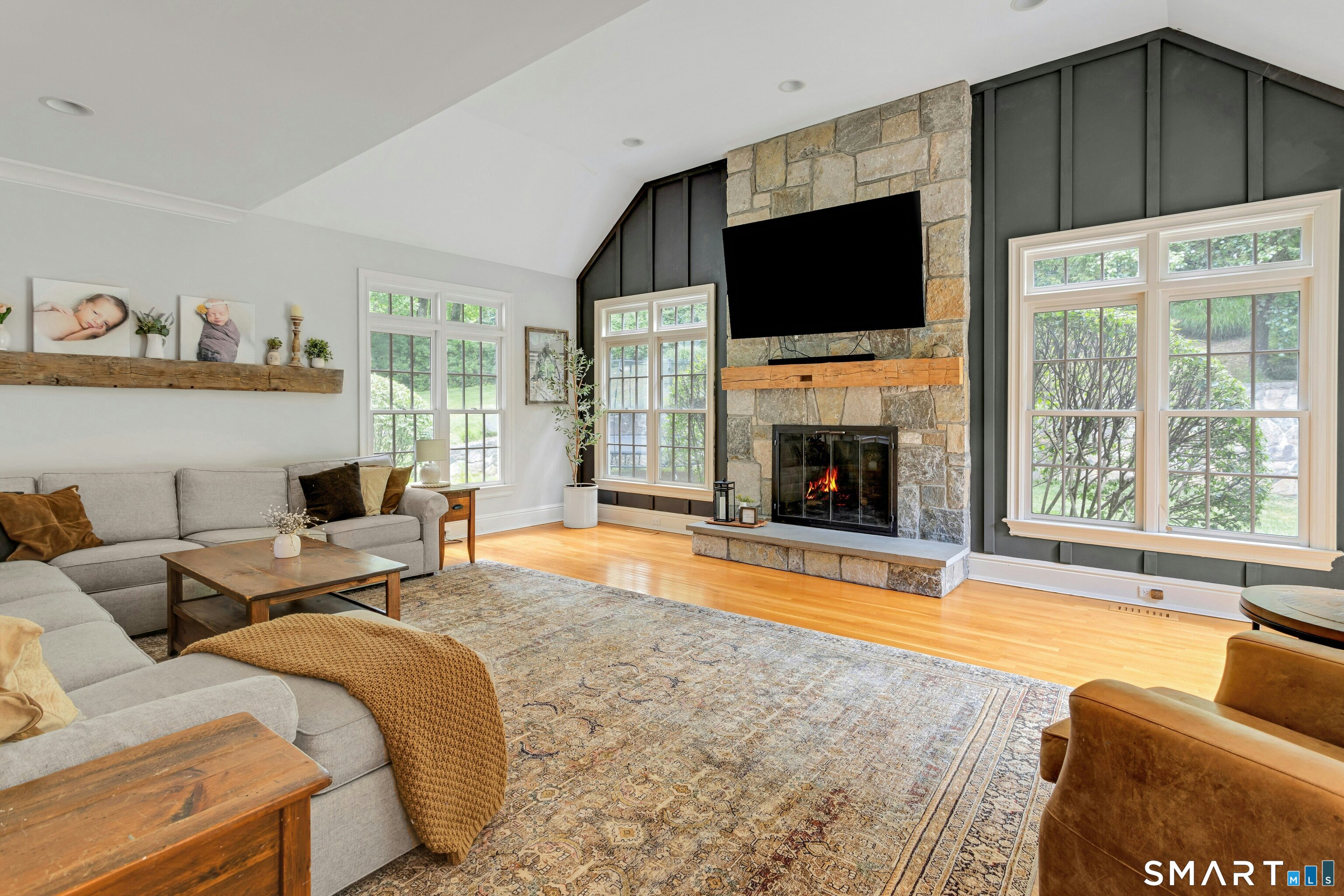 14 Turtle Ridge Court Ridgefield, CT 06877 - Photo 13 of 40 Great Room with Stone Fireplace, Vaulted Ceiling & Custom Woodwork