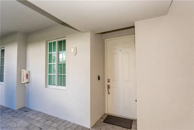 a view of an entryway with wooden floor