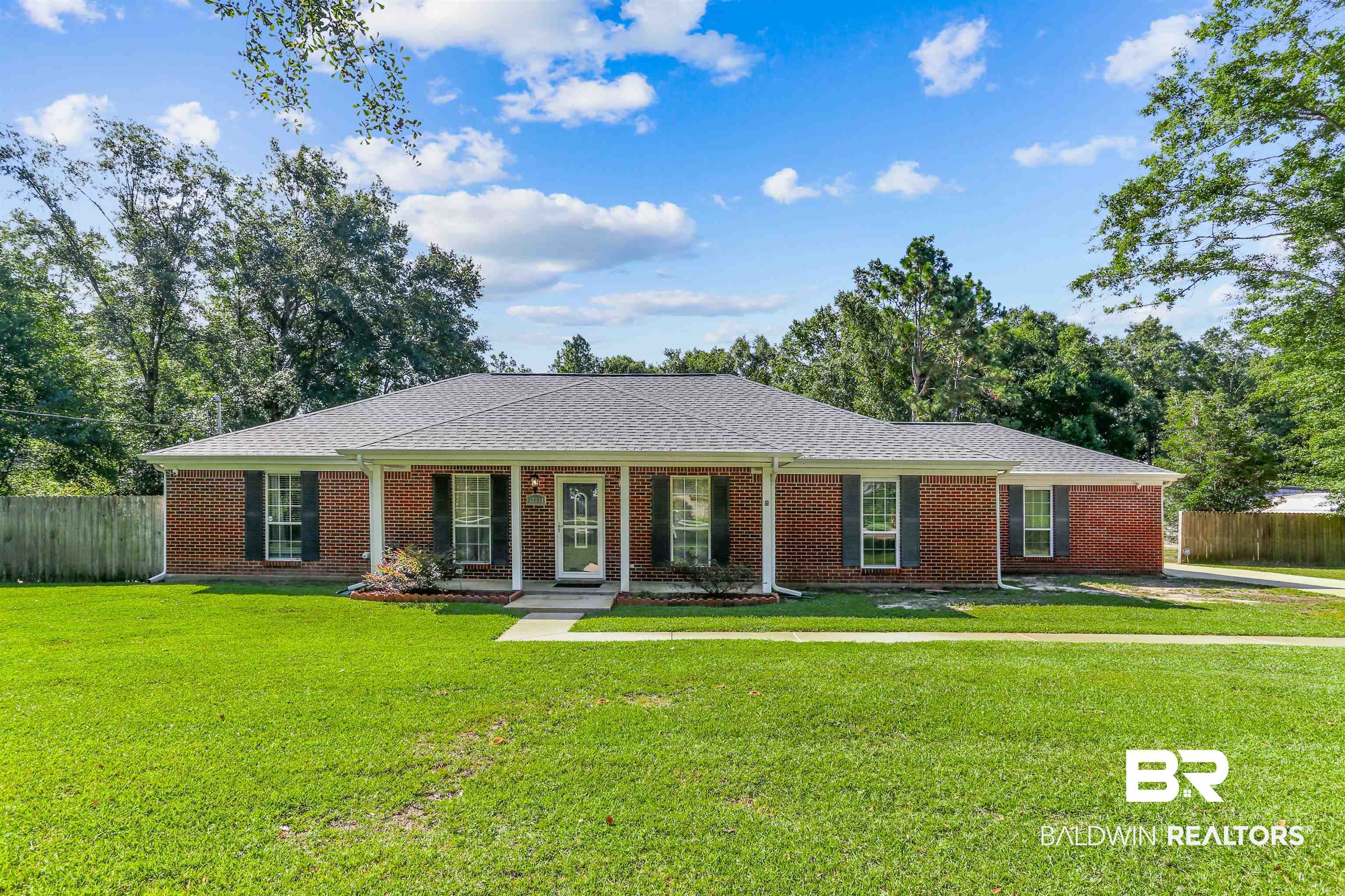 32334 Riverlake Road Seminole, AL 36574 - Photo 3 of 47 Single story home featuring covered porch, brick siding, and roof with shingles